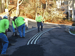 Installation of a ClearZone heated driveway in asphalt.