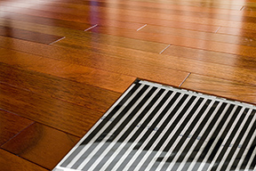 FilmHeat floor heating element under a hardwood floor.